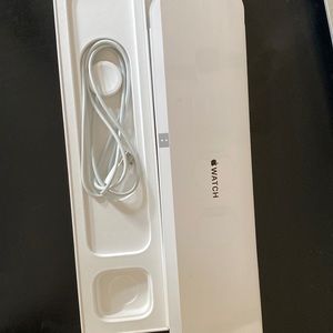 Apple Watch charger with empty Apple Watch box